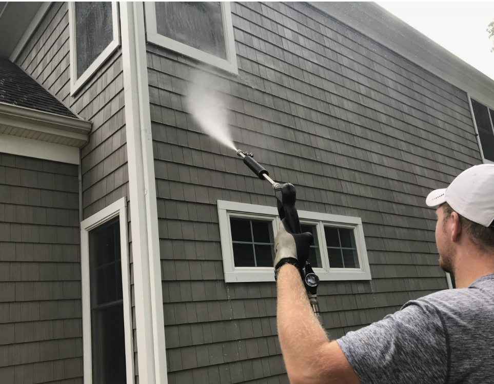 Ocean Crest Painting soft washing a Pensacola home exterior